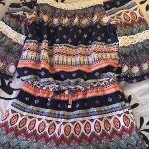 A colorful boho style kids romper